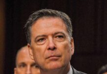 James Comey at a hearing, close-up portrait