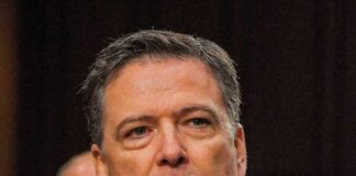 James Comey at a hearing, close-up portrait